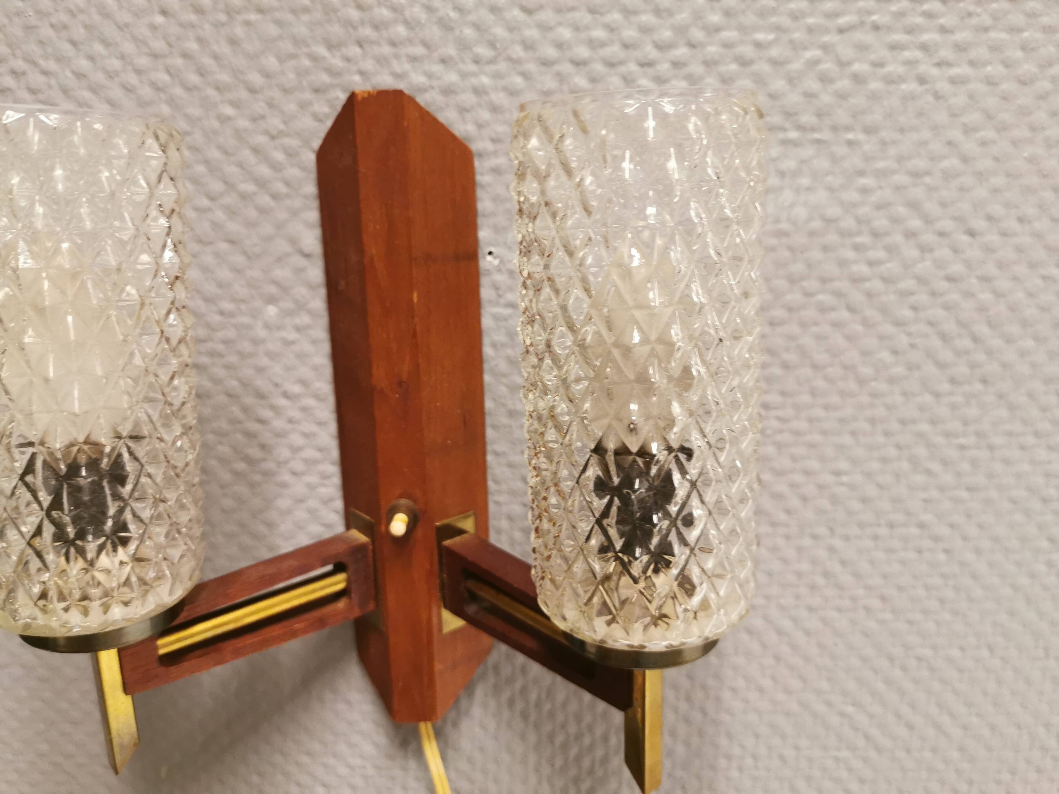 Danish double wall light in teak, brass and crystal glass.