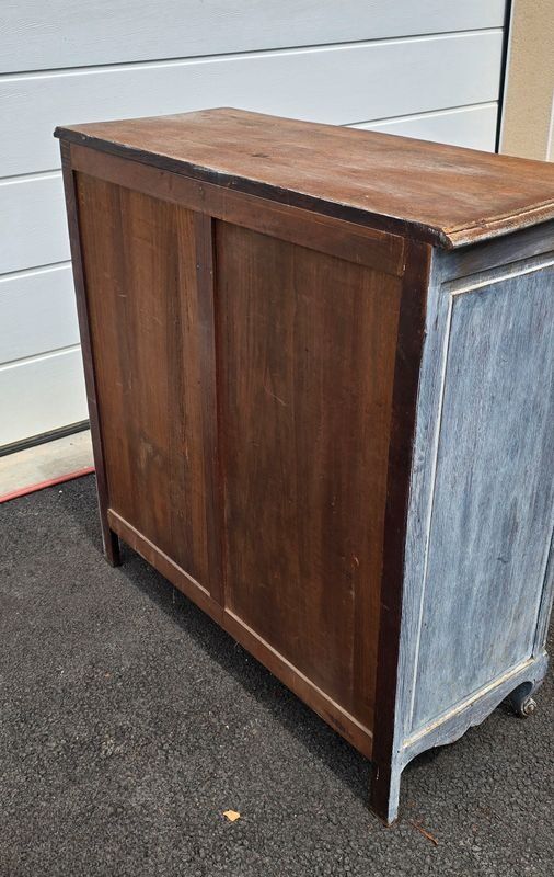 Antique chest of drawers with a cerused and patinated finish.
