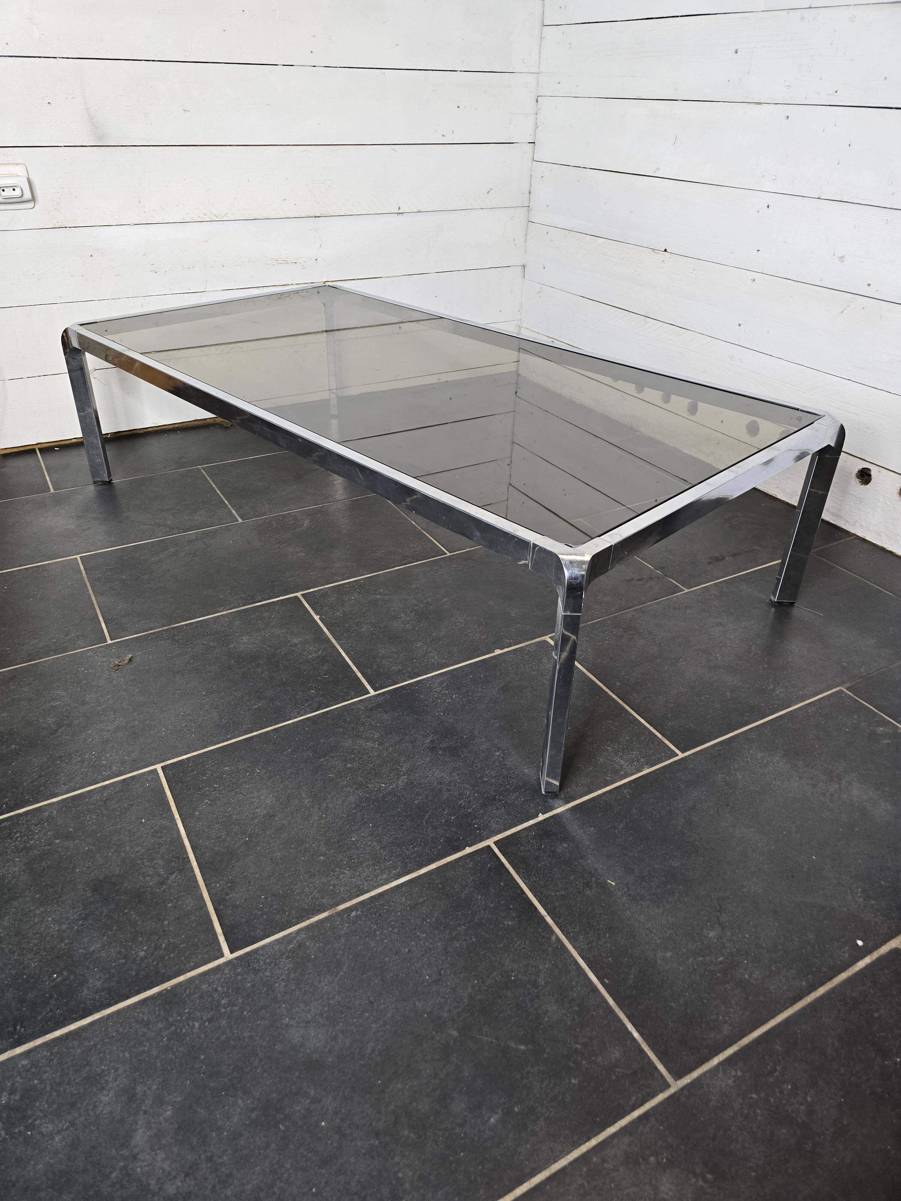 Chromed metal coffee table with smoked glass top from the 70s
