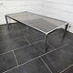Chromed metal coffee table with smoked glass top from the 70s