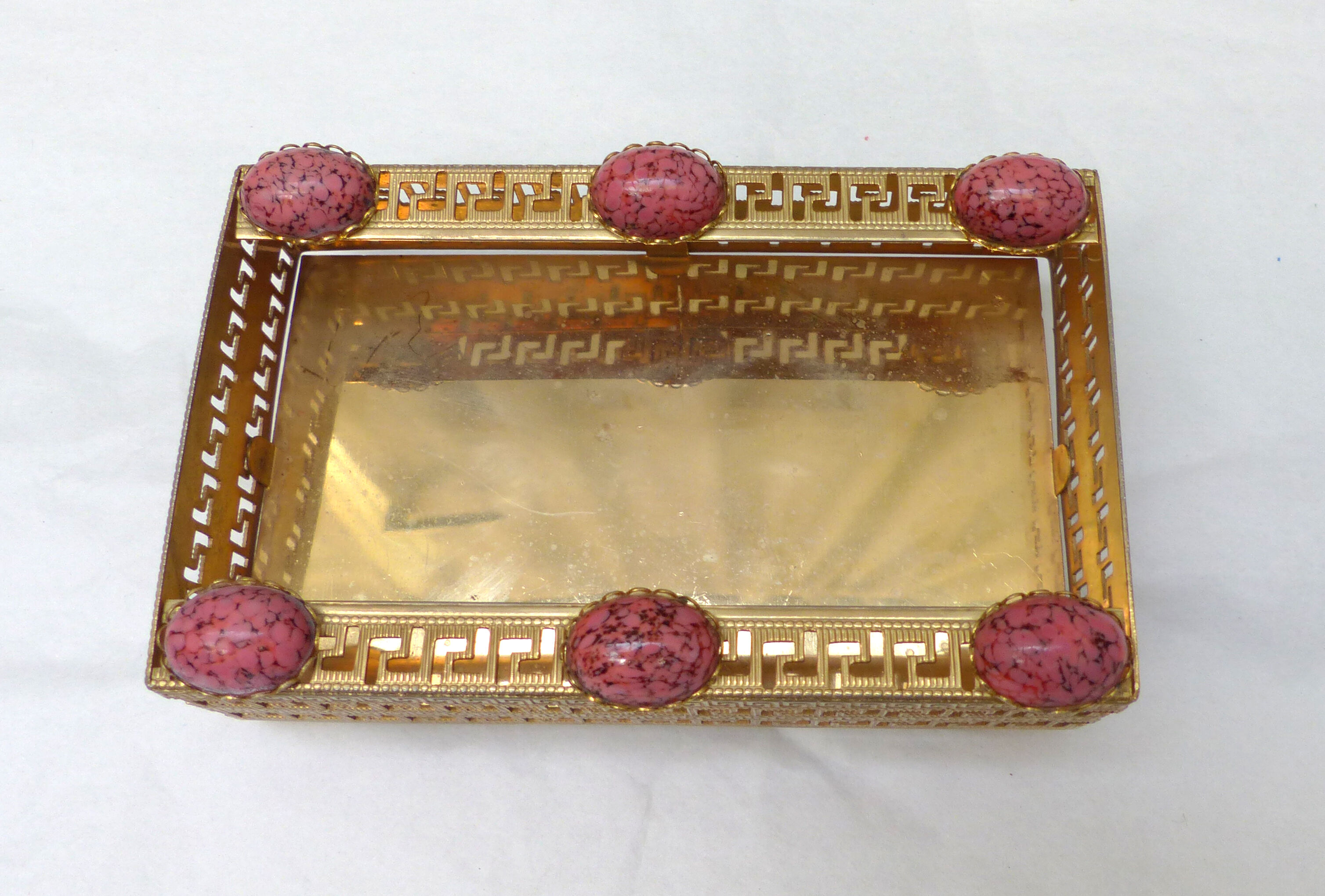 Golden metal catchall with pink stones