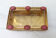 Golden metal catchall with pink stones