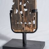 Indonesian construction element in carved wood with intertwined plant motifs mounted on a base (fri