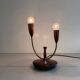 Simple double-headed table lamp in wood and brass, 1960s, Germany.