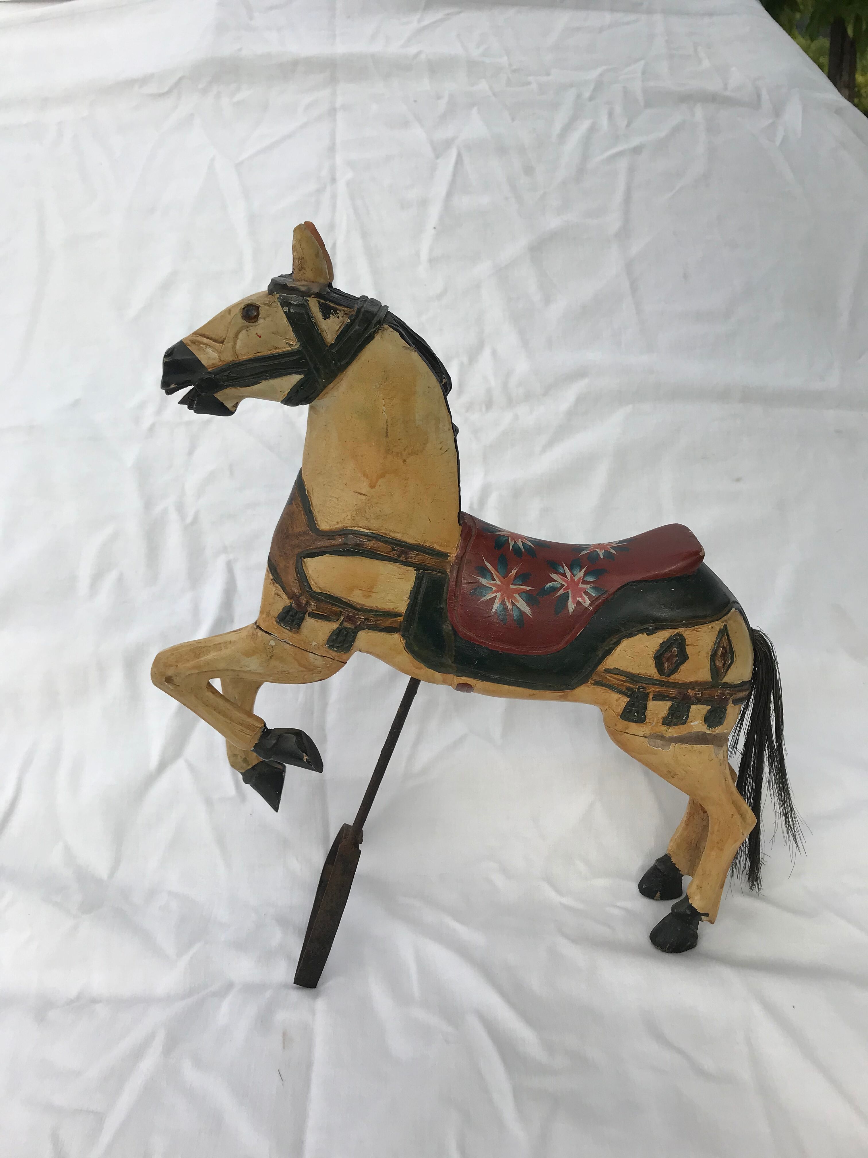 Wooden horse with period ironwork support