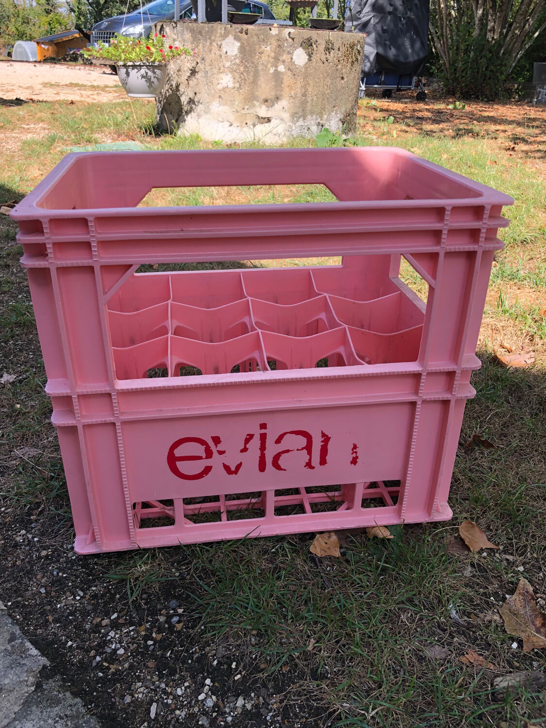 Evian bottle holder in pink plastic
