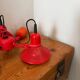 Three-lamp suspension in Memphis design style in red metal.