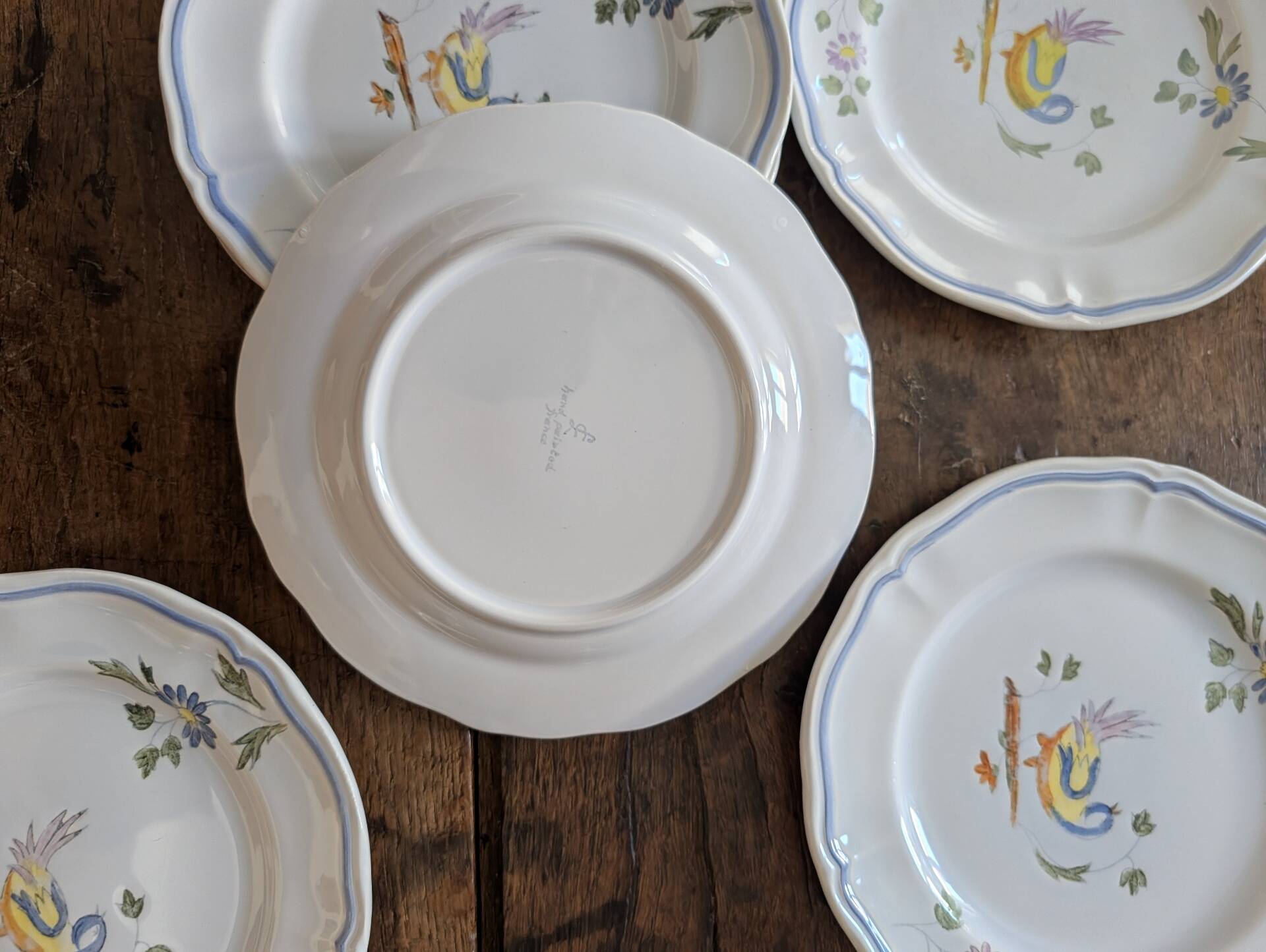 7 hand-painted earthenware dessert plates – France, 1950s