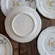 7 hand-painted earthenware dessert plates – France, 1950s