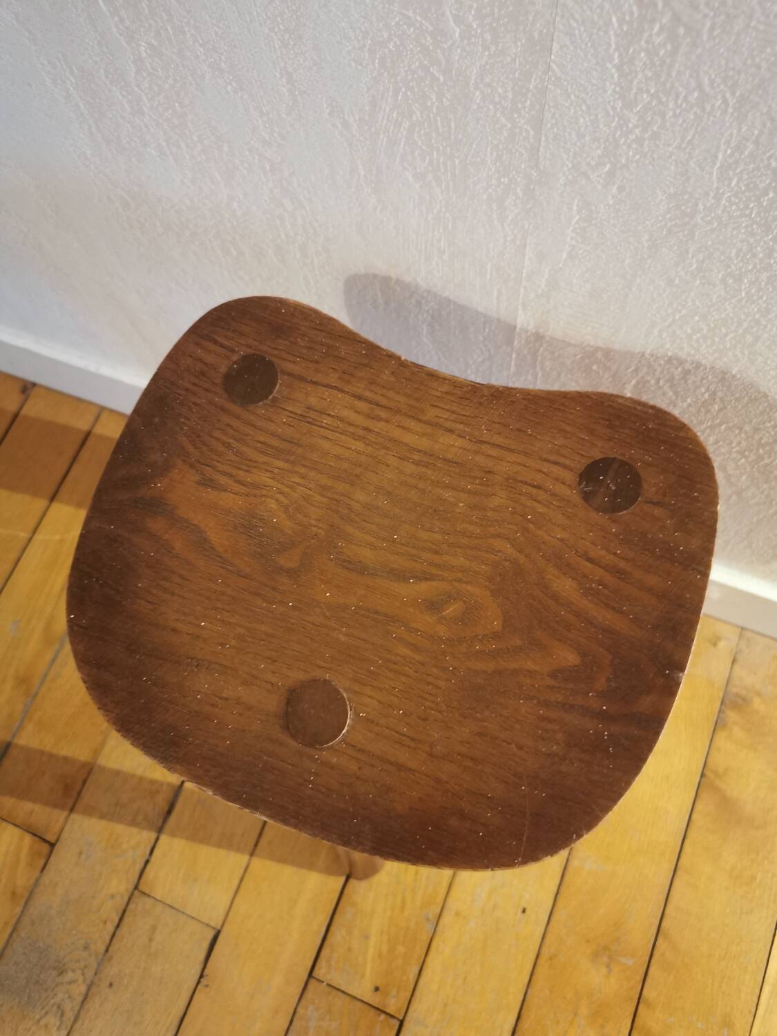 Old wooden tripod bench stool milking shepherd’s bench