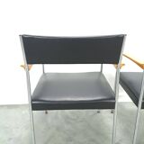 Chaises DDR avec base chromée et revêtement noir, chaises de salle à manger
