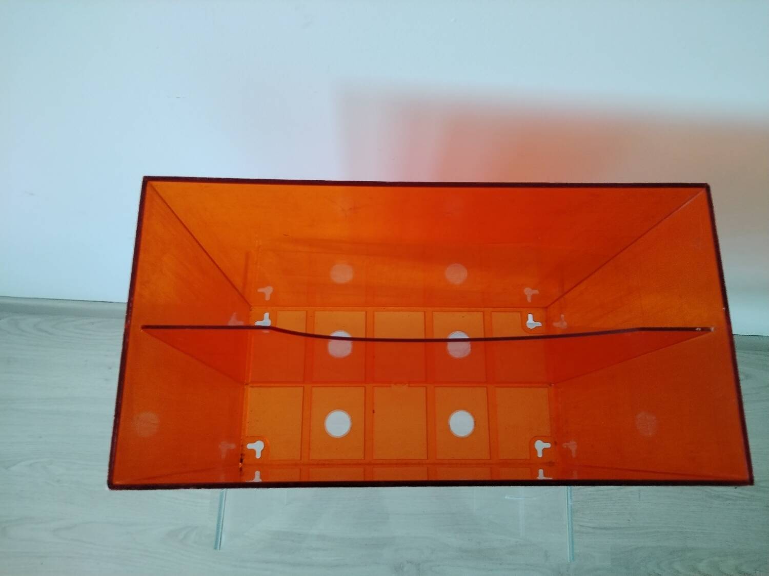 Vinyl magazine holder in orange plexiglass