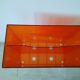 Vinyl magazine holder in orange plexiglass