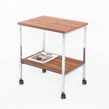 Vintage side table on wheels. Chrome-plated iron tube and wood. France, 1970s.