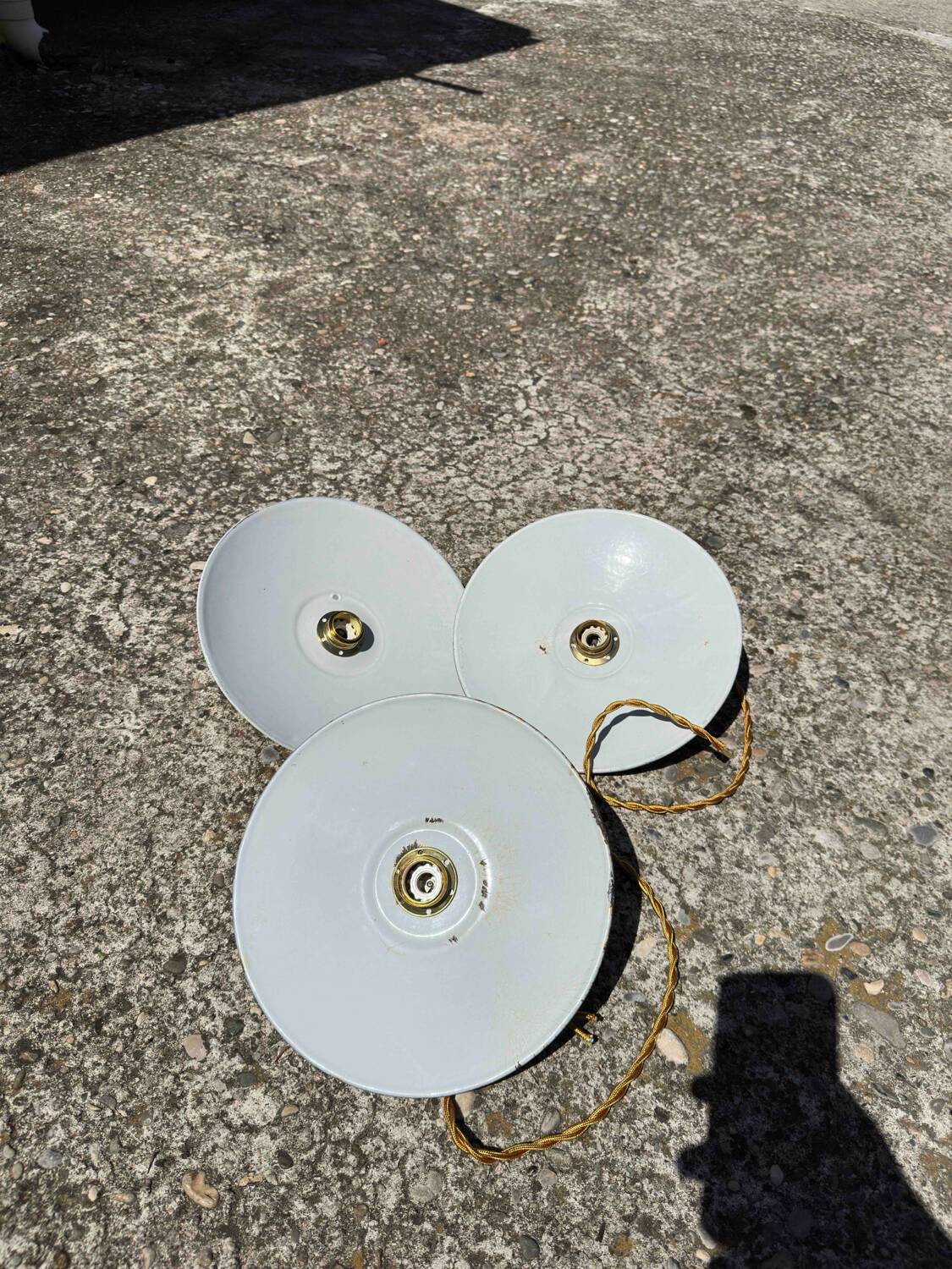 Trio of vintage pendant lampshades in enamelled sheet metal with gold threads