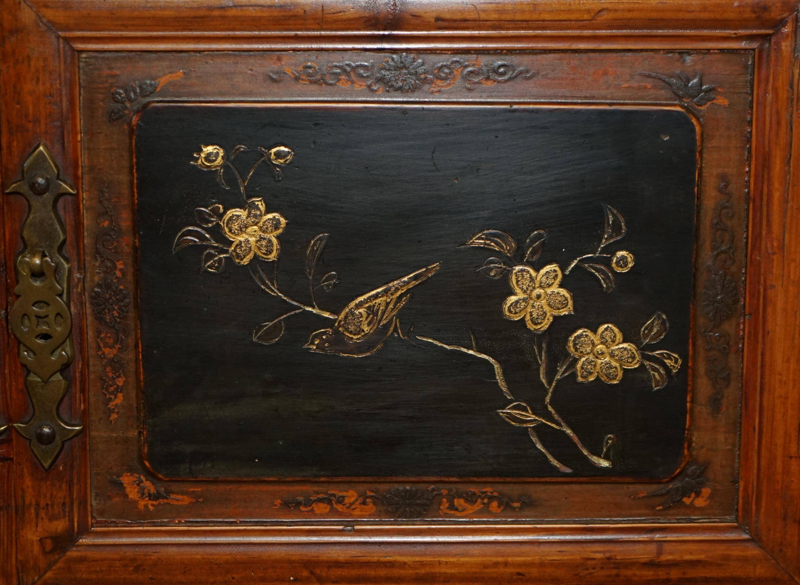 Antique Chinese armoire hand-carved around 1880 with country-style handles.