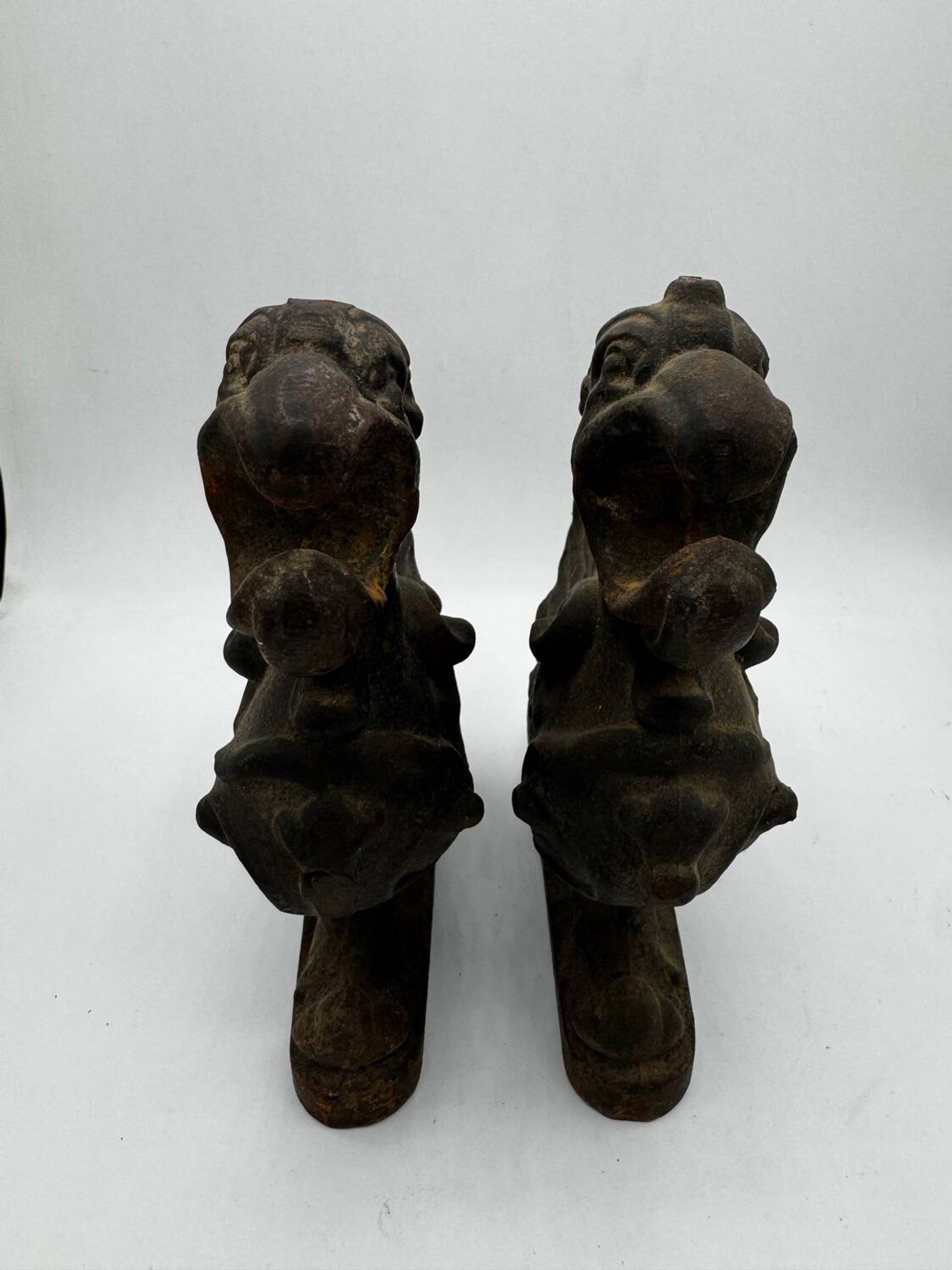 Pair of winged chimera and dragon fire dogs in cast iron