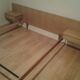 Bed with integrated bedside tables