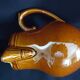 Old covered milk jug, side handle