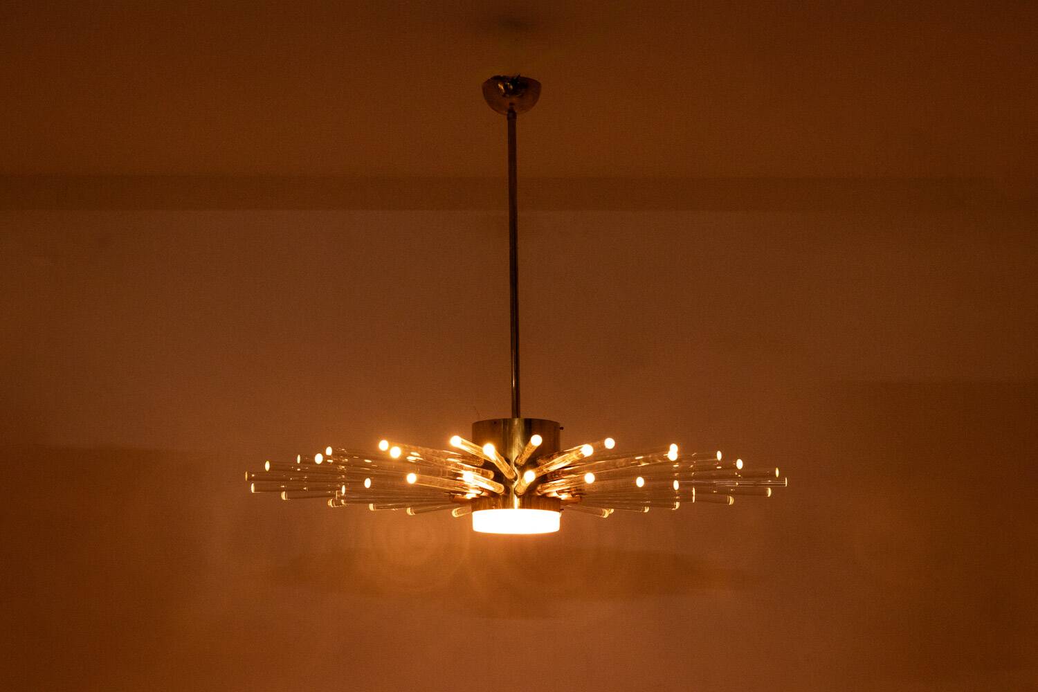 Radiant glass tube chandelier. Contemporary design.