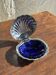 Vintage silver-plated shell butter dish with blue bowl.