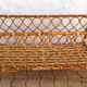Lit d'enfant en rotin vintage