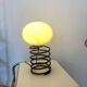 Lampe à poser ressort dans le goût d'Ingo Maurer