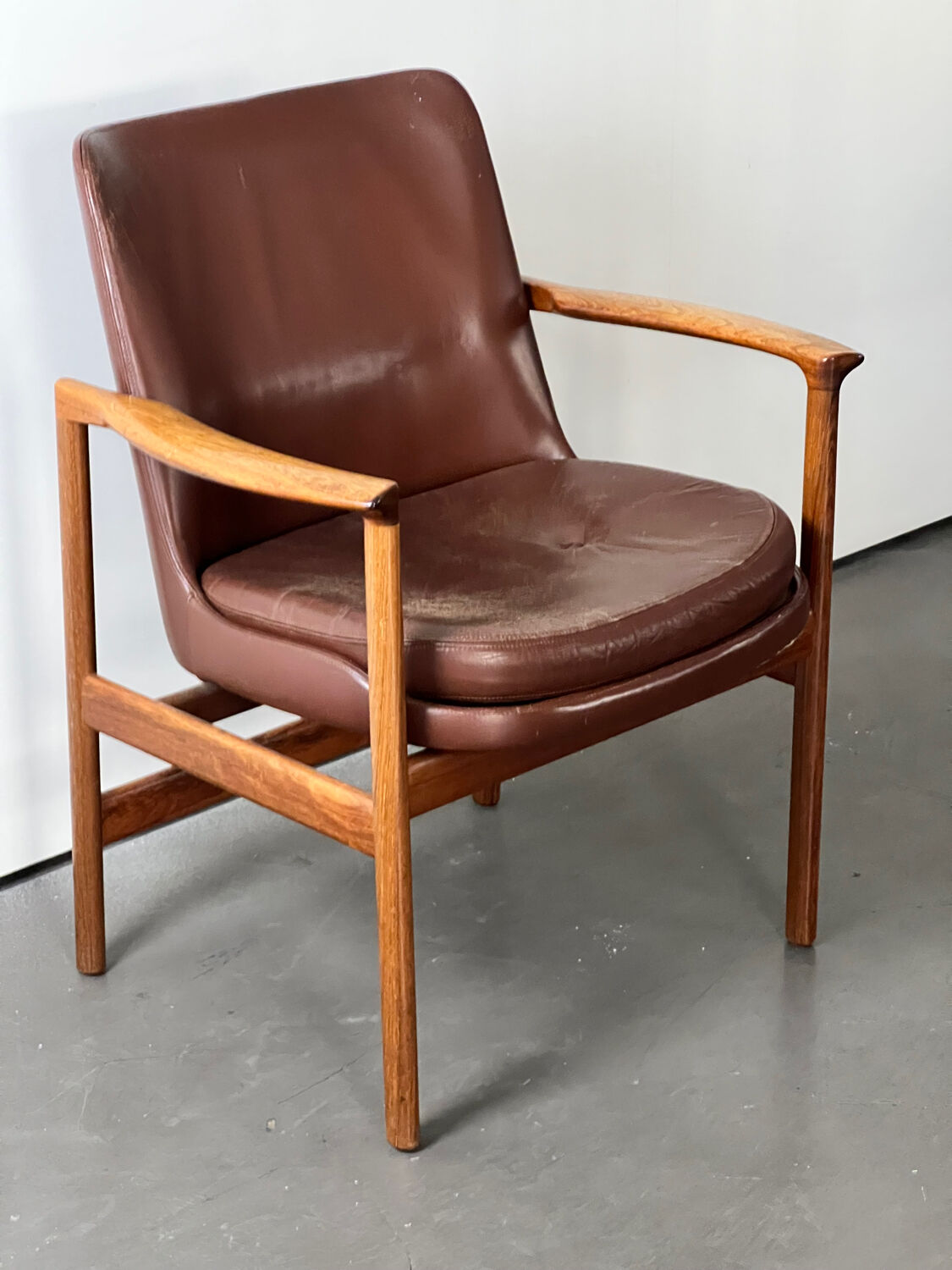 Leather and wood armchair by Ib Kofod Larsen