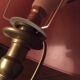Table lamp at the foot candlestick