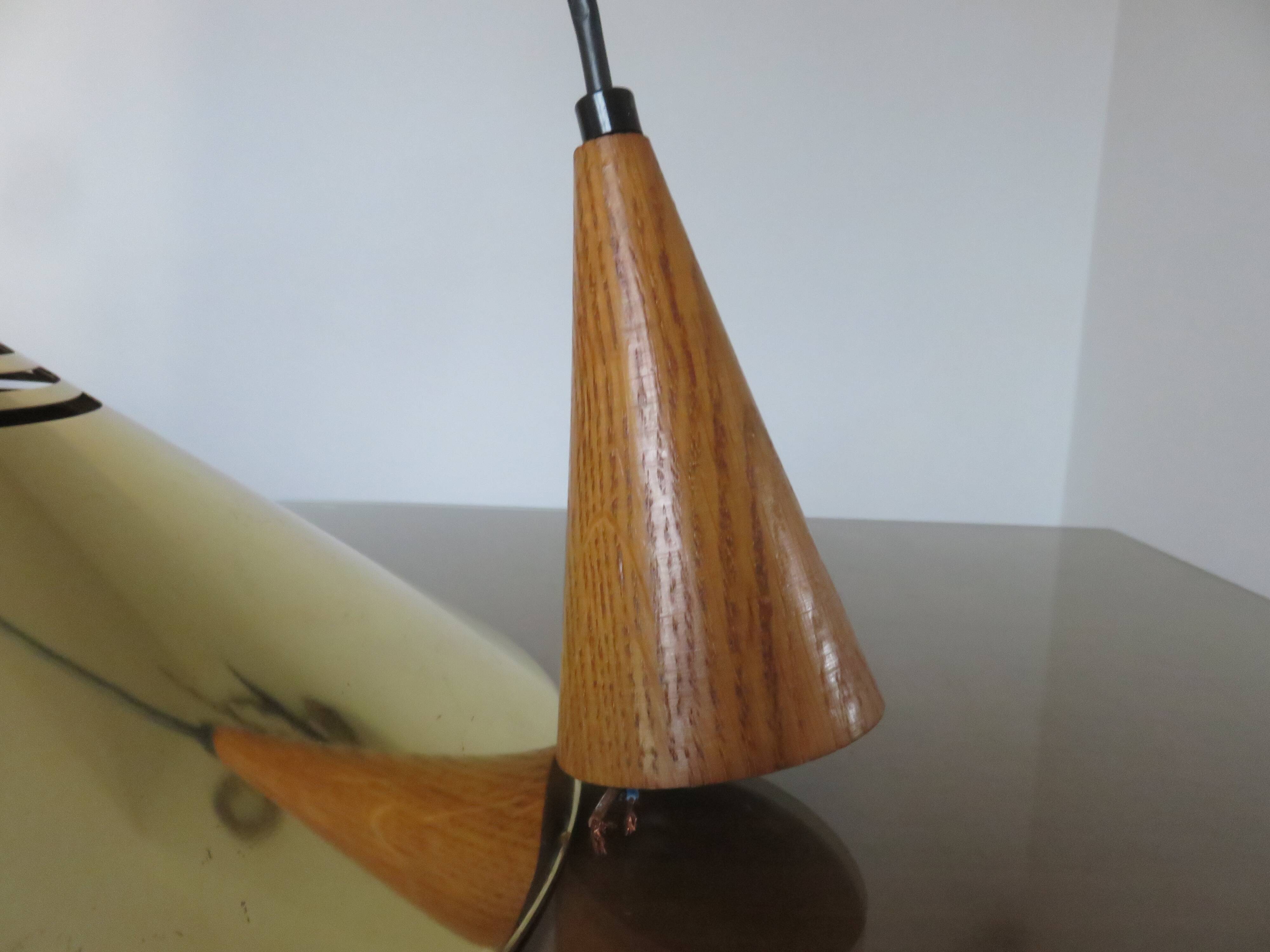 Scandinavian teak and gold metal pendant light from the 70s