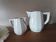 2 white porcelain milk jugs with platinum trim, Flora by Apilco.