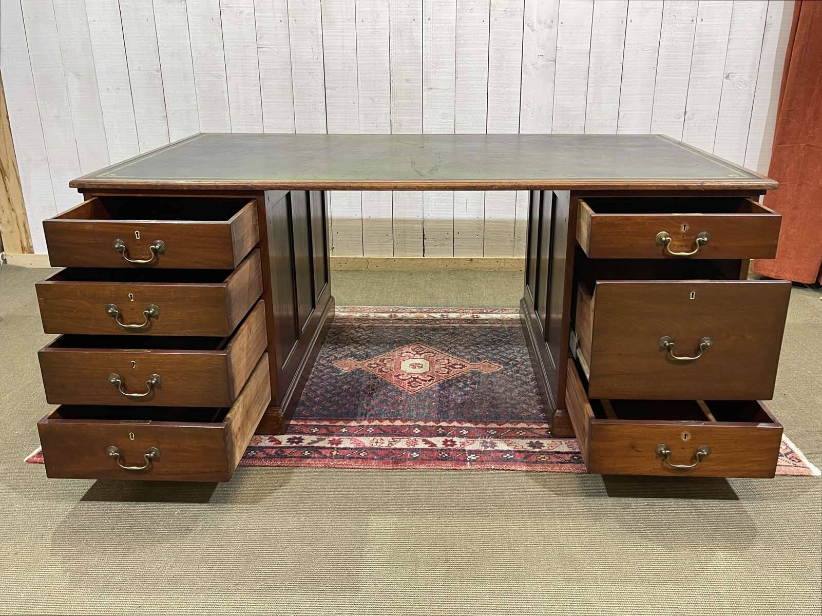 Large English flat desk in mahogany with leather top, early 20th century