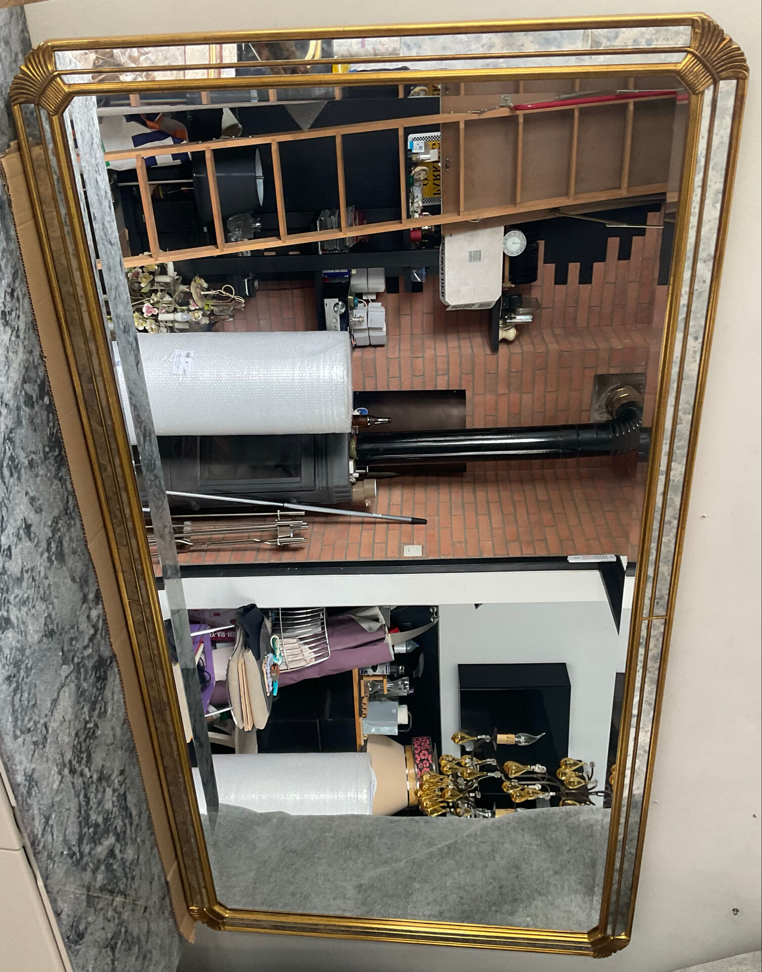 Large gold mirror by Deknudt with parcloses from the 1970s.