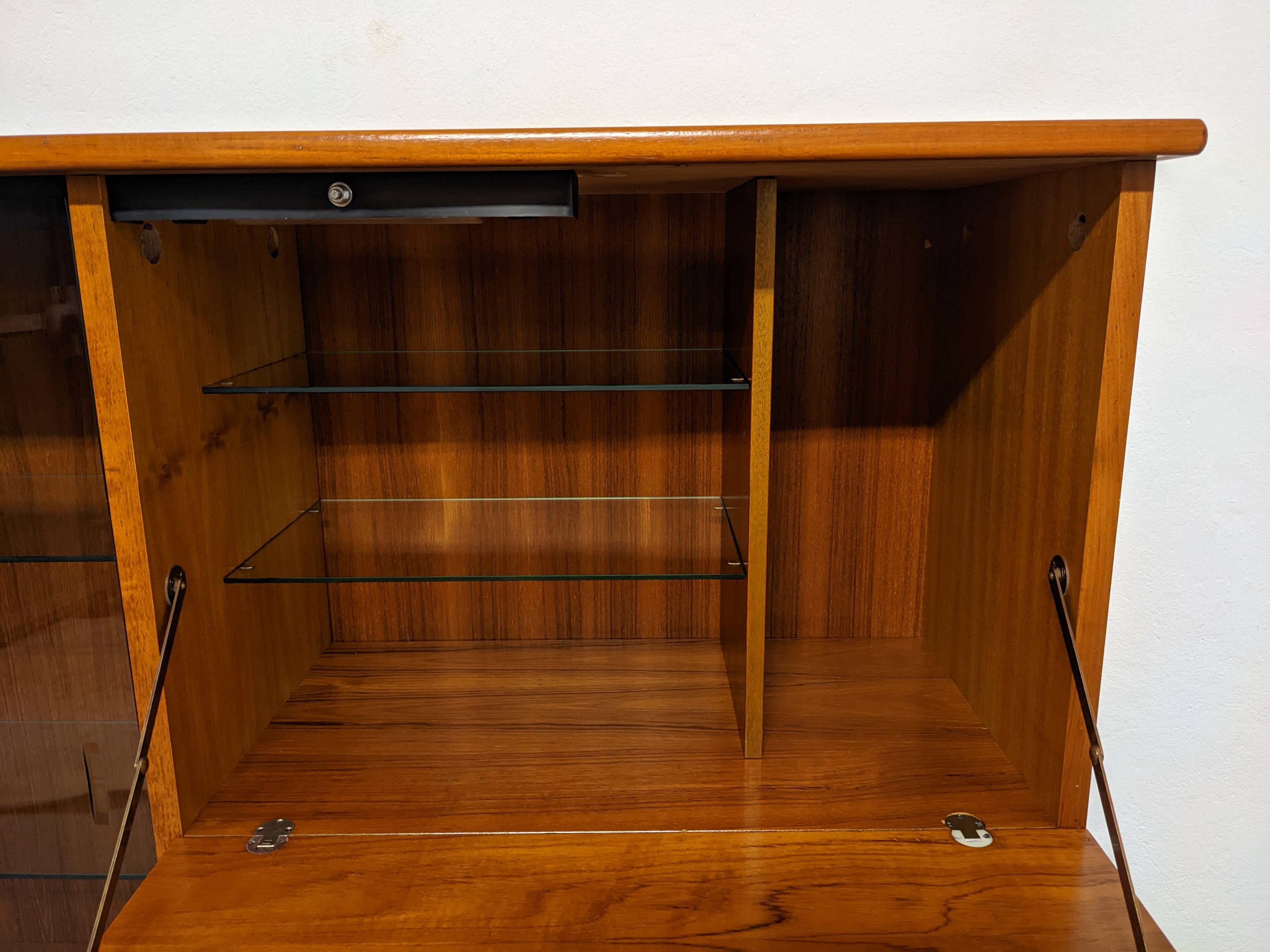 High sideboard, display cabinet and secretary, Scandinavian in teak, France around 1960.