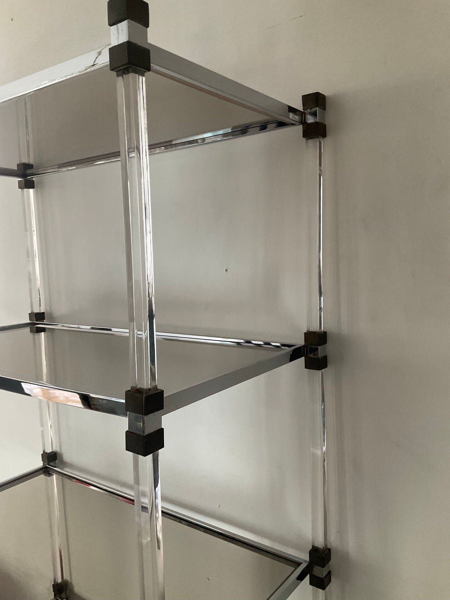 Vintage shelf in lucite, brass, and smoked glass from the 1970s.