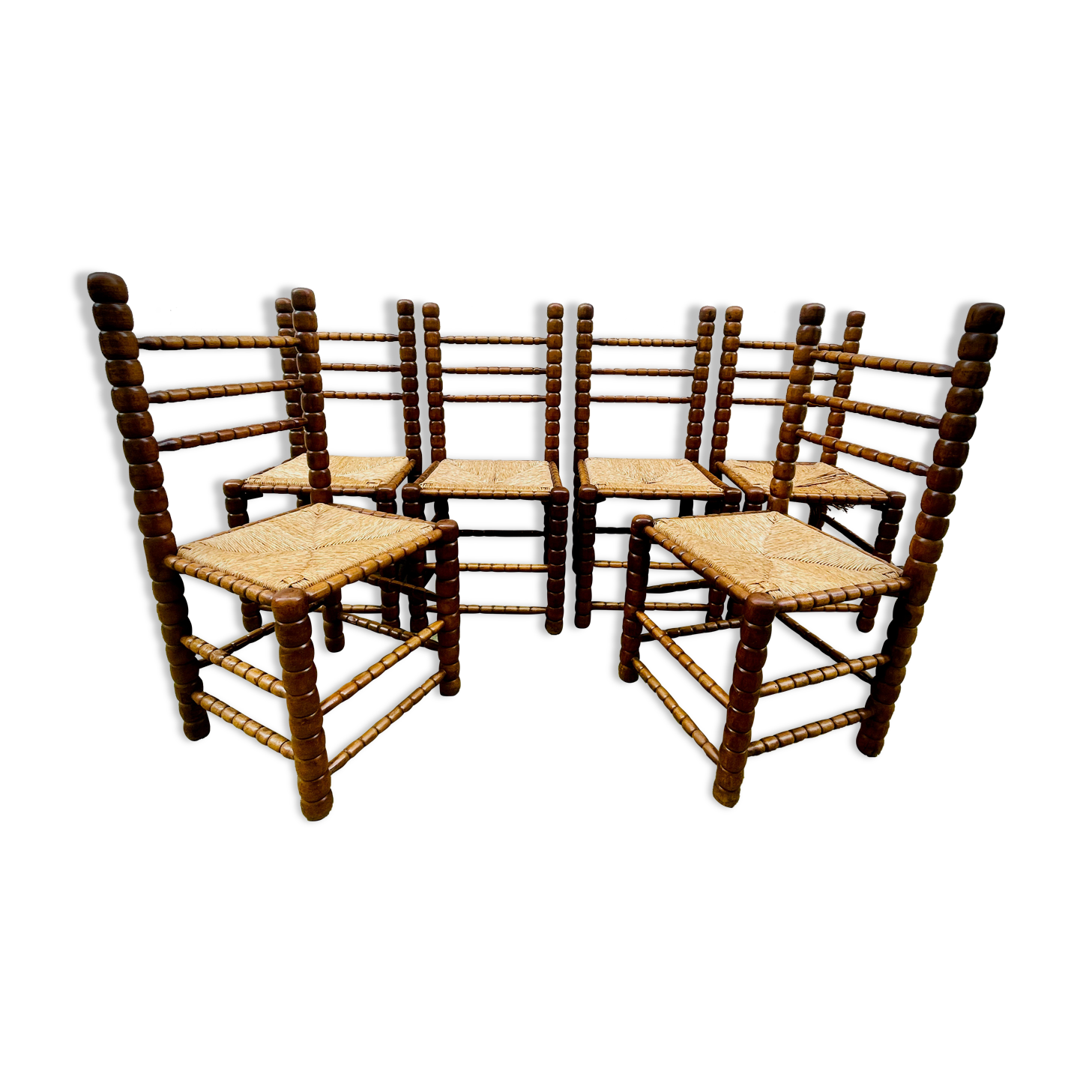 Brutalist chairs mulched in turned wood from the 60s