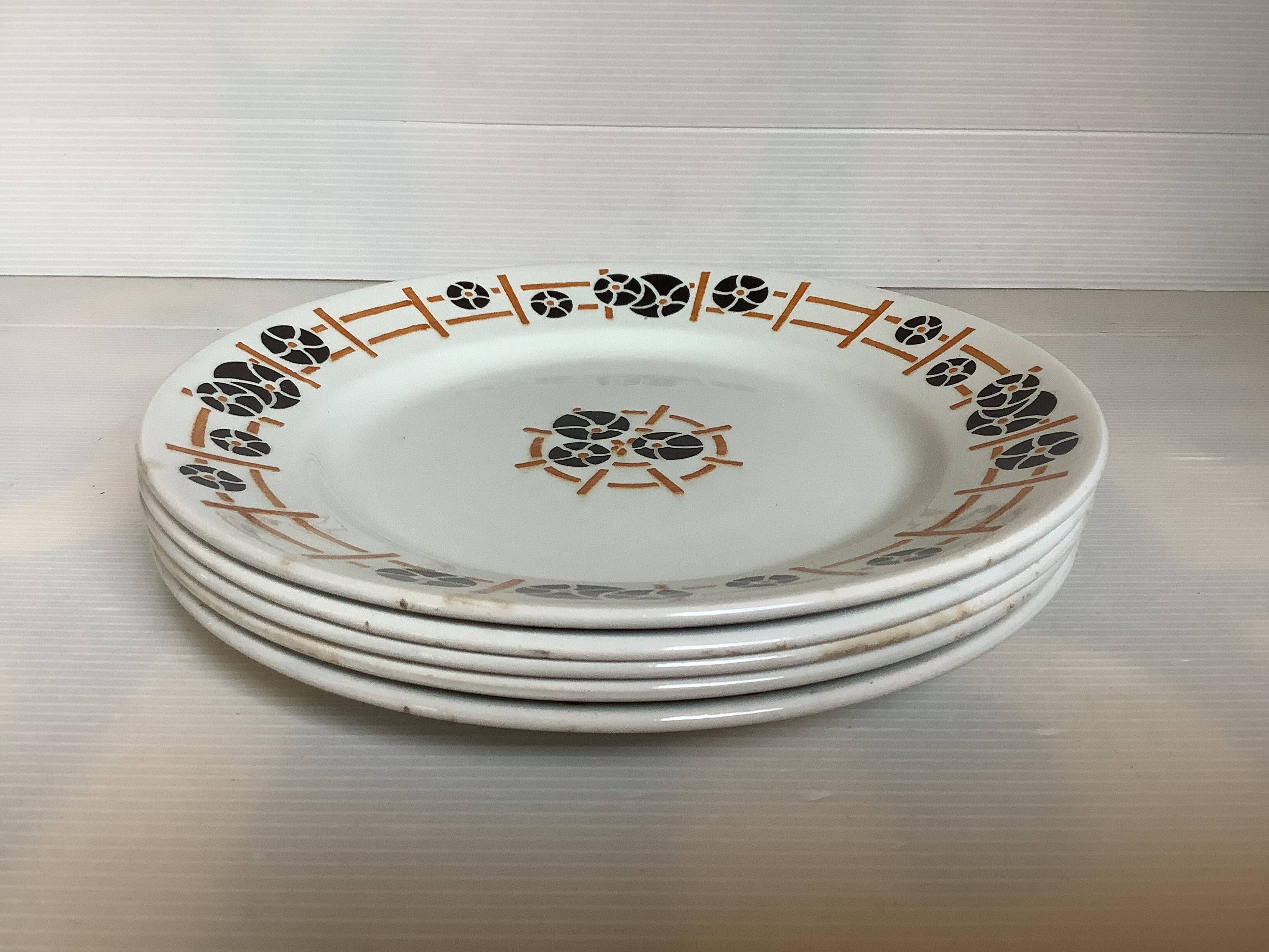 Five old flat earthenware plates from the 1930s, water lilies model