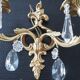 Pair of gilt bronze wall sconces with crystal pendants.