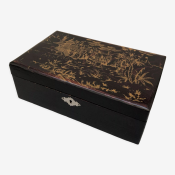 Old black wooden box with Asian décor