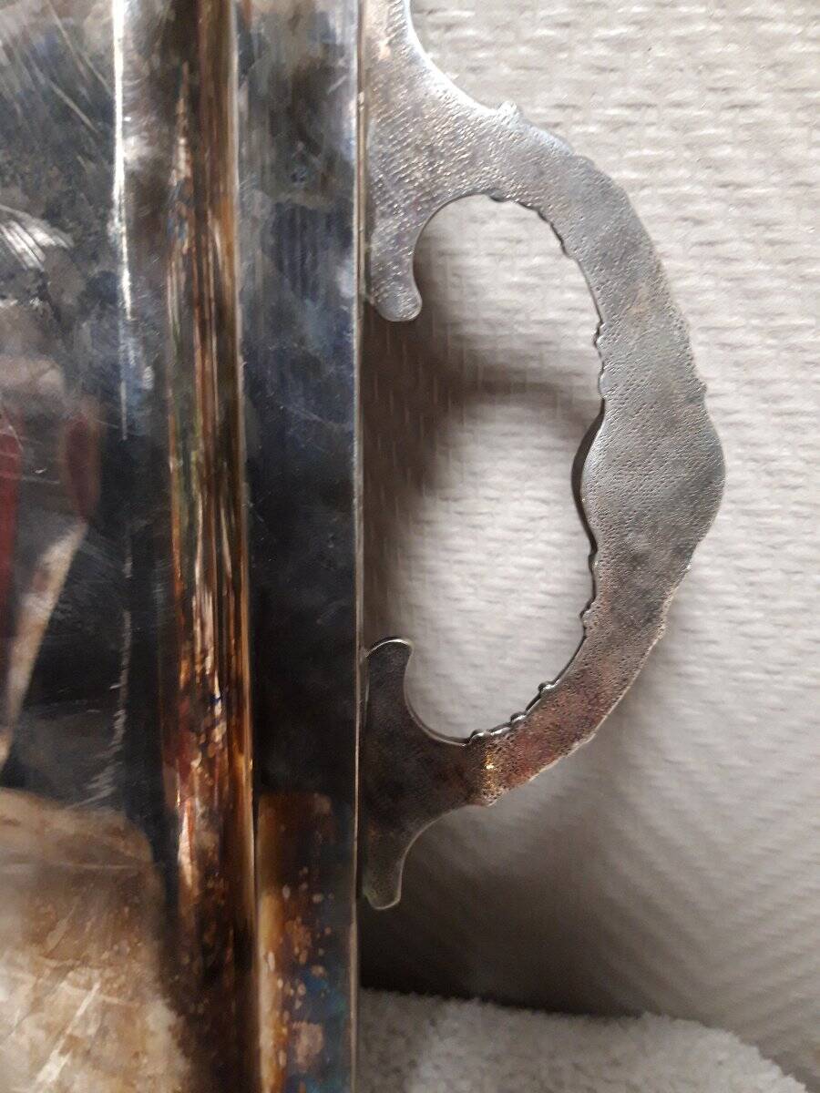 Silver-plated service tray with handles, neoclassical decoration.