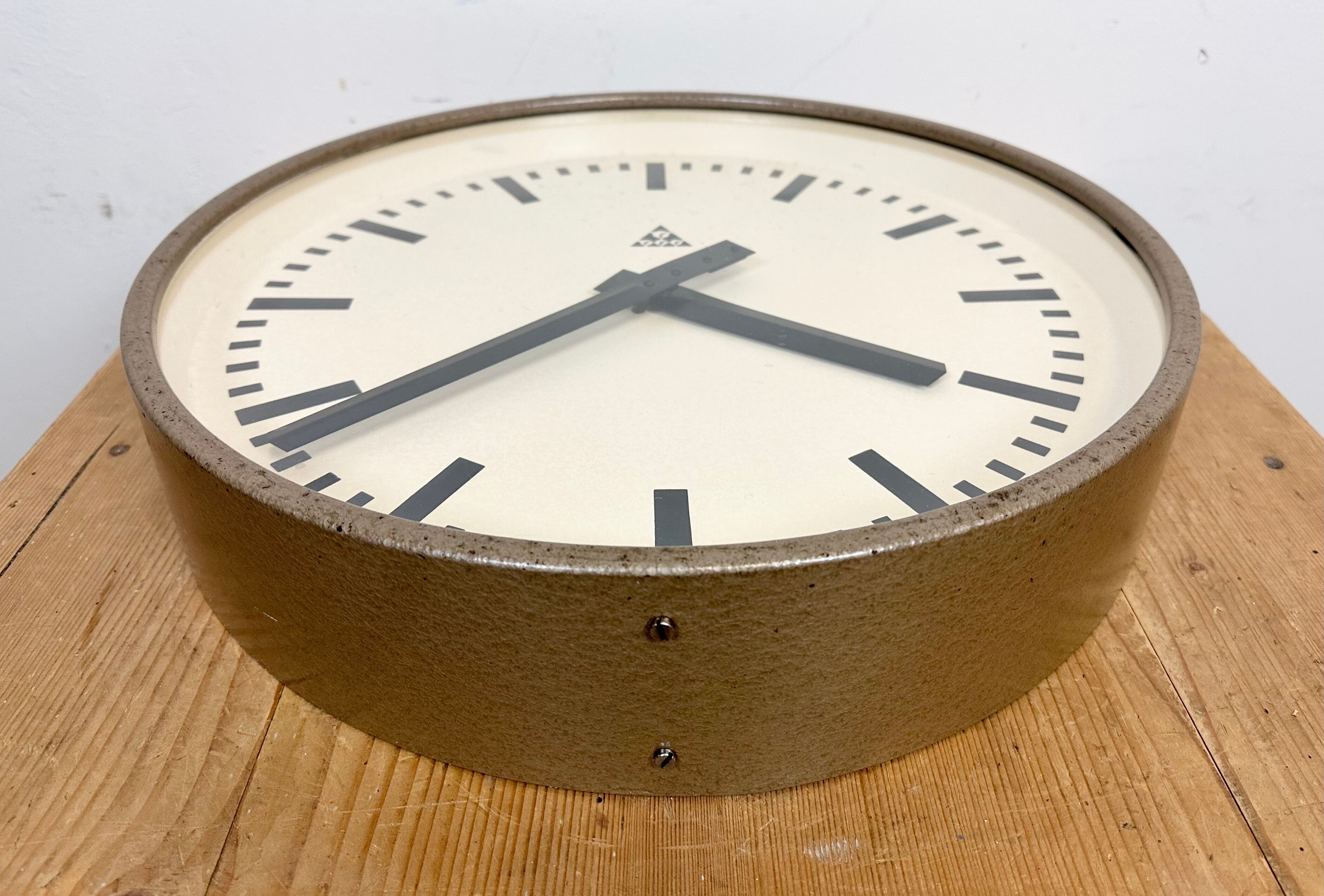 Brown industrial factory wall clock from Pragotron, 1960s
