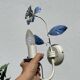 Pair of blue metal floral wall lights