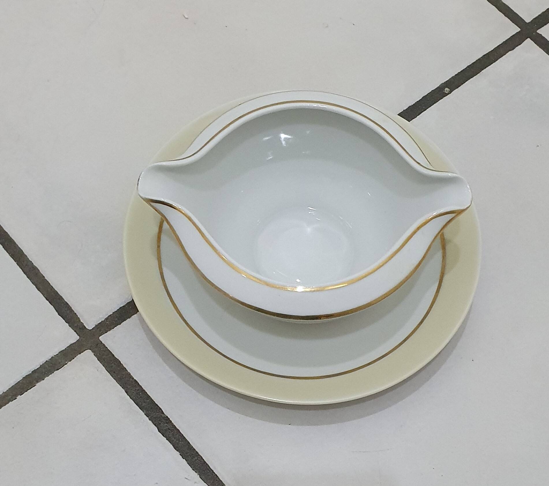 White and yellow porcelain dinner service with gold edging, Poral Limoges France