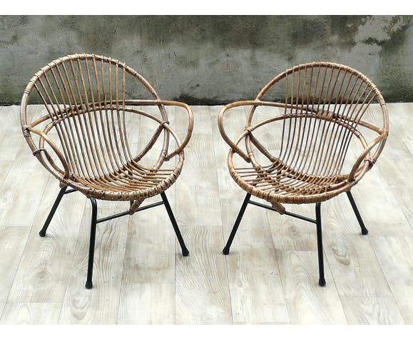 Pair of rattan shell chairs with metallic feet