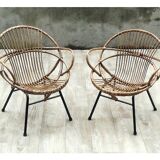 Pair of rattan shell chairs with metallic feet