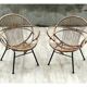 Pair of rattan shell chairs with metallic feet