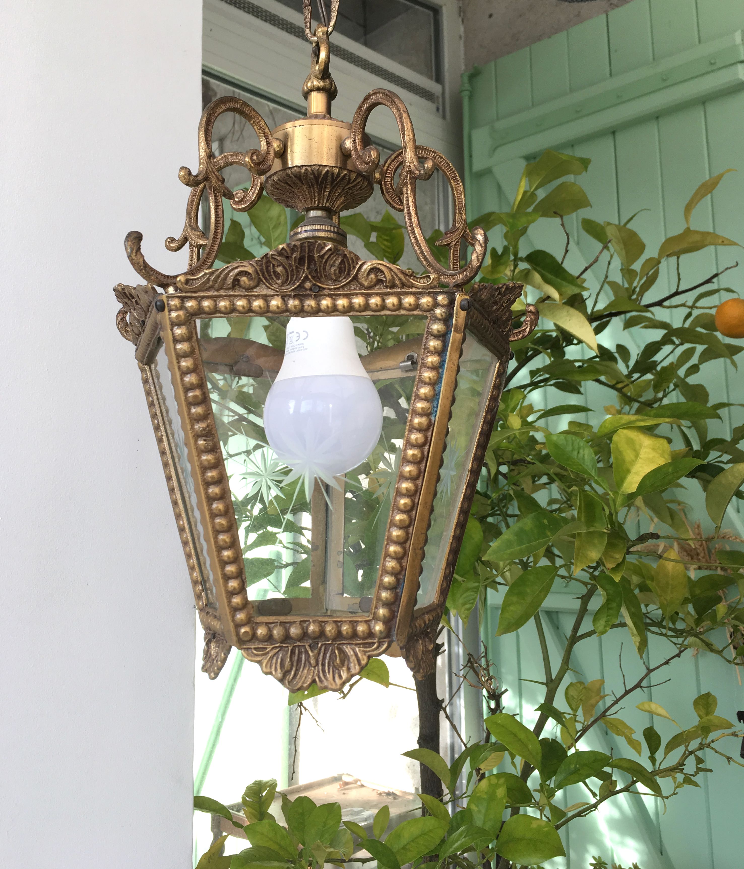 Hanging brass lantern and engraved glass