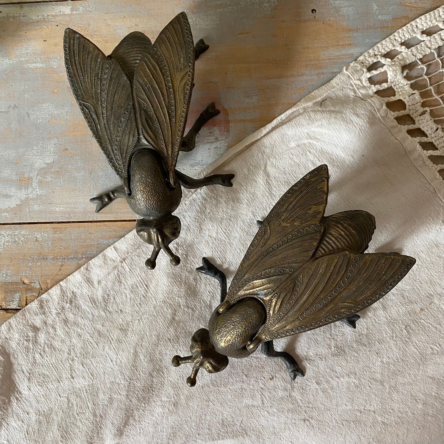 2 metal ashtrays with insect fly designs from the 1950s-60s.