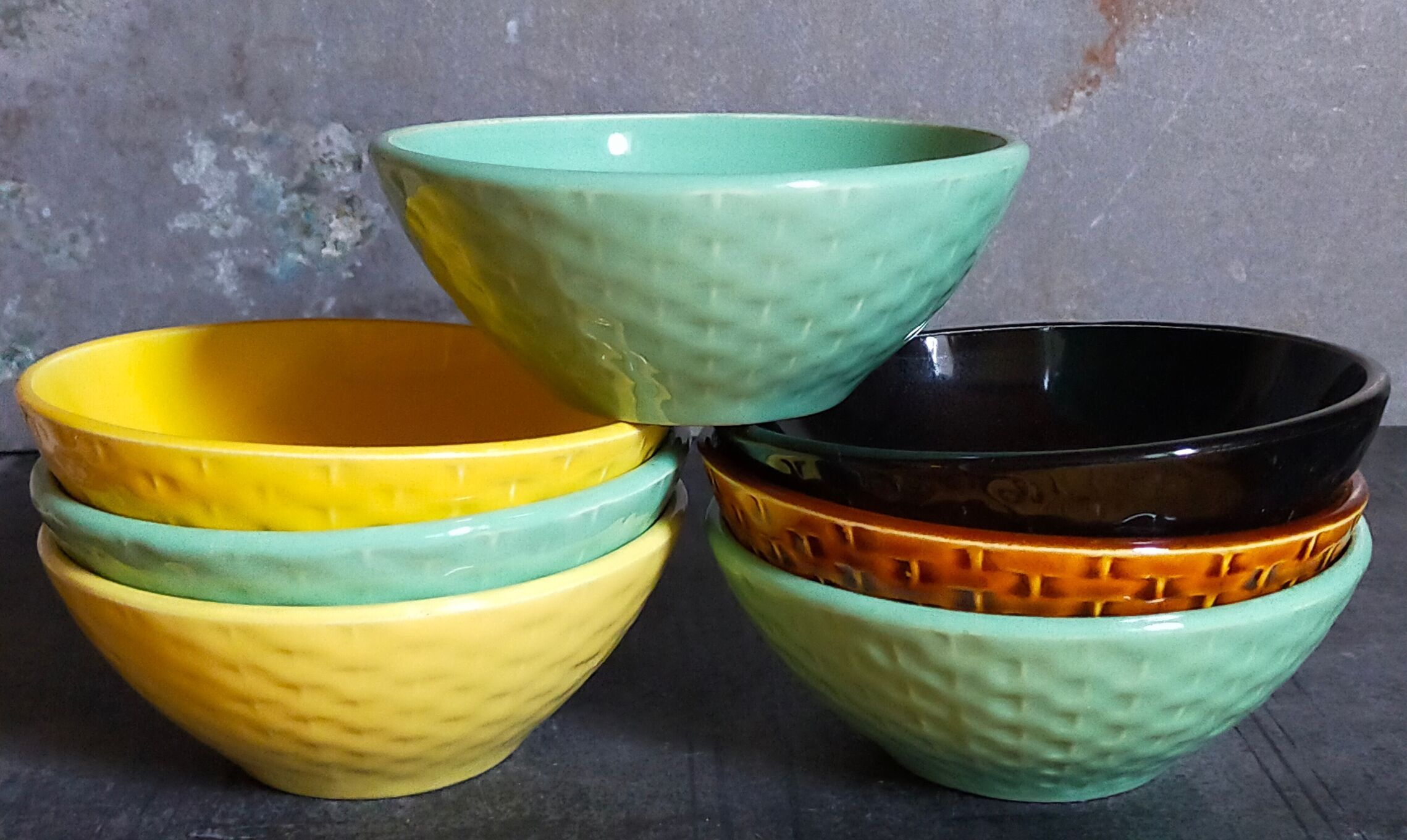 Seven vintage slip ceramic bowls
