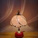 Vintage pink glass globe lamp with brass details and pink base